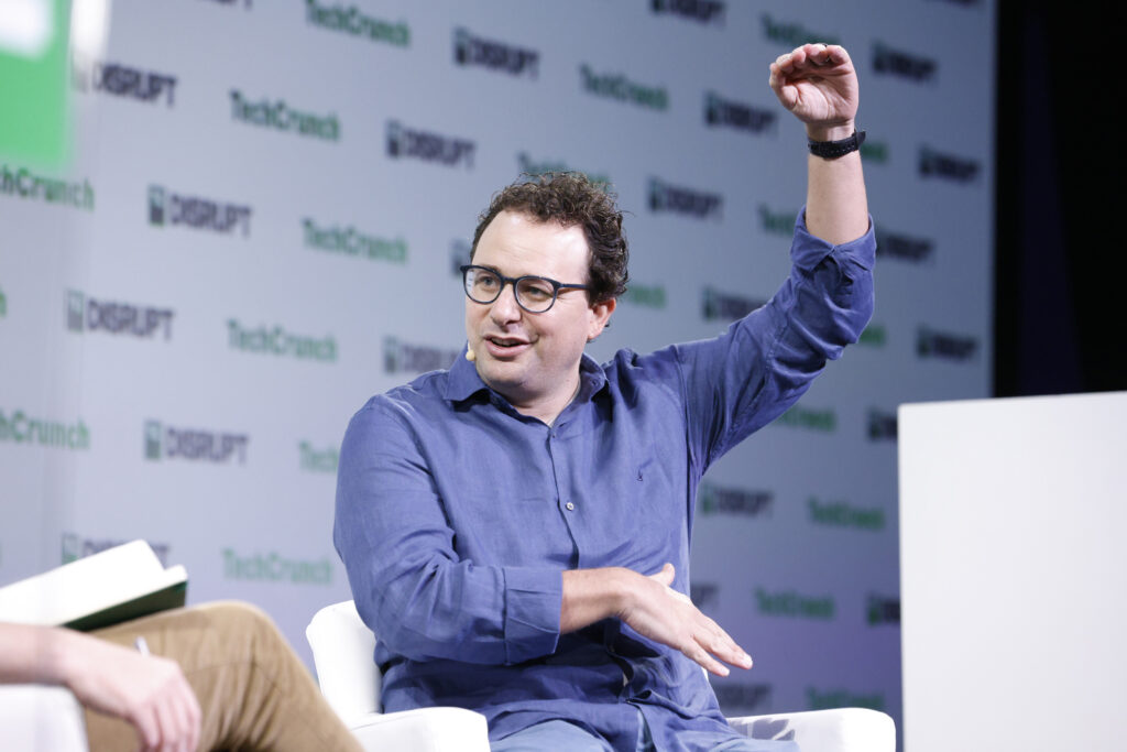 Dario Amodei, chief executive of Anthropic, speaking on a stage at TechCrunch Disrupt in 2023